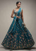 Ocean Green Lehenga Choli In Raw Silk With Colorful Resham Embroidered Spring Blossoms