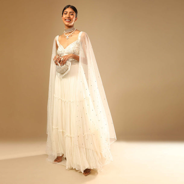 Off White Gown In Georgette With Tiered Flare And Hand Embroidered Leaf Motifs On The Bodice
