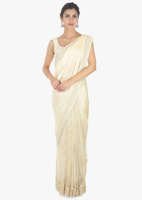 Off white half and half saree in chiffon and net saree with embellished scallop border 