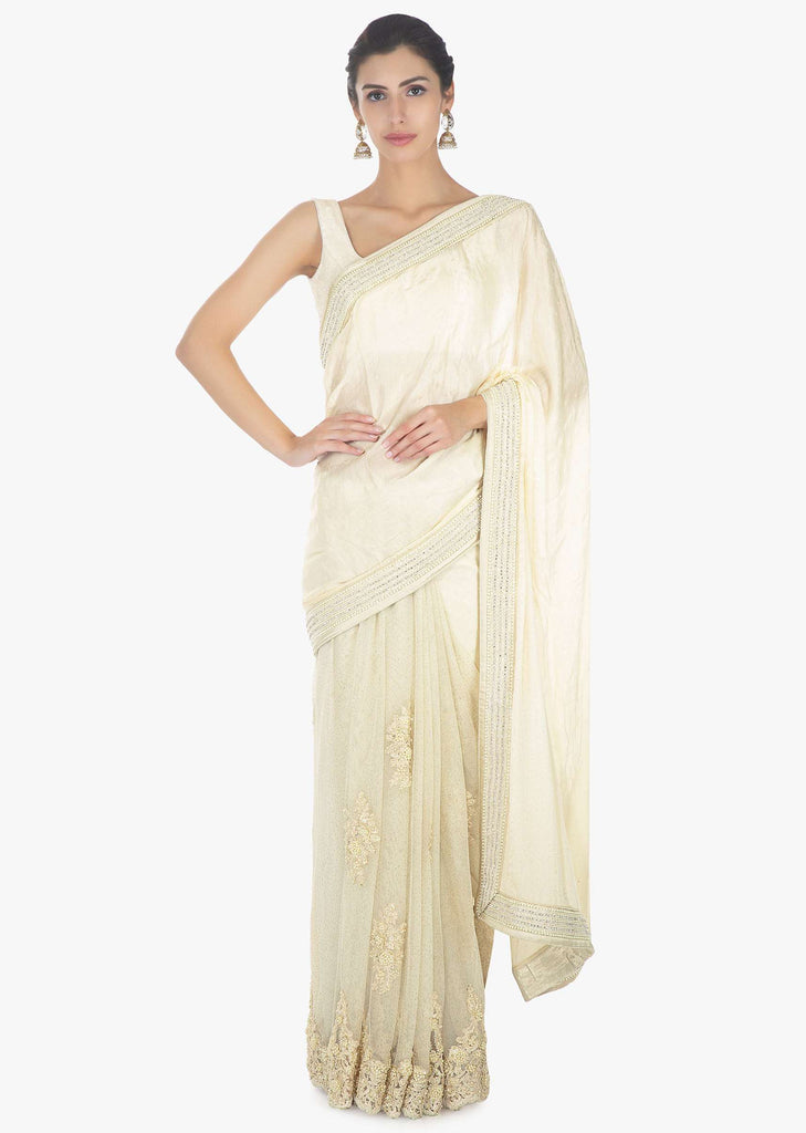 Off white half and half saree in chiffon and net saree with embellished scallop border 