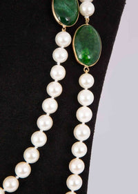 Off white long pearl necklace enhanced with emerald green semi precious stone only on Kalki