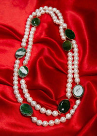 Off white long pearl necklace enhanced with emerald green semi precious stone only on Kalki