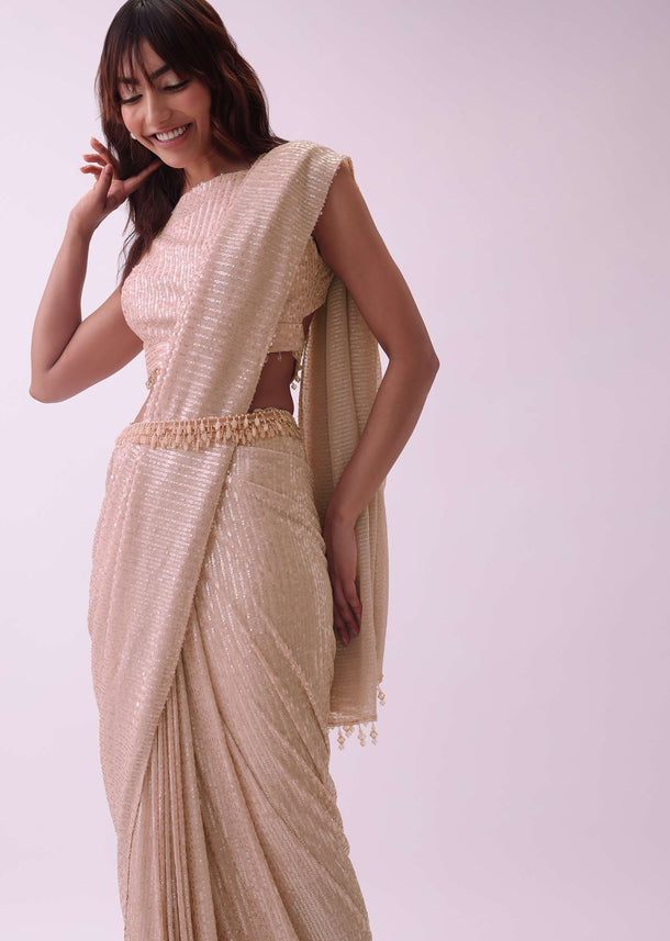 Off-White Saree And Stitched Blouse With Hanging Crystals