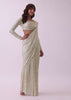 Off-White Sequins Saree And Blouse With Cowl Sleeves And Tassels