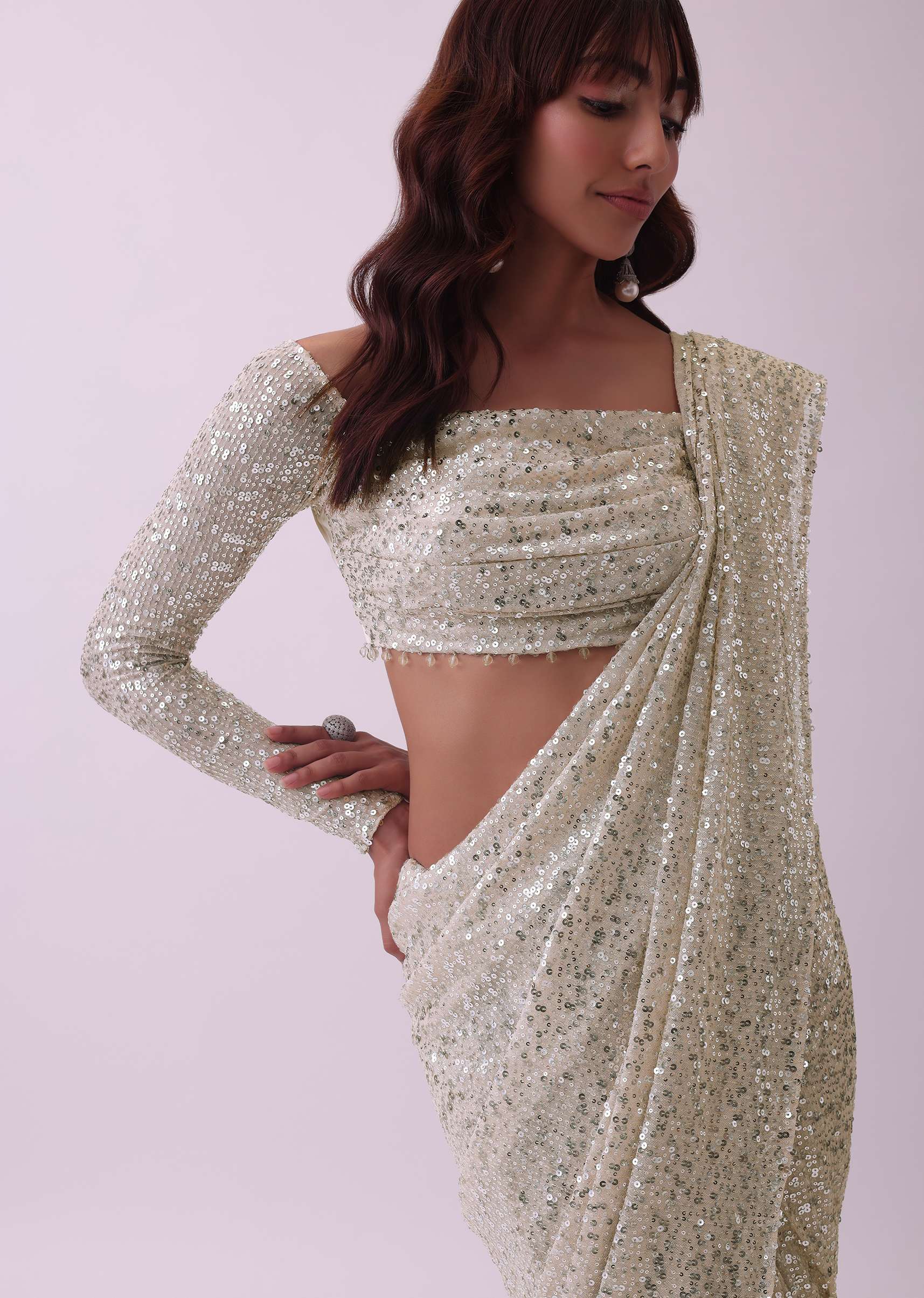 Off-White Sequins Saree And Blouse With Cowl Sleeves And Tassels