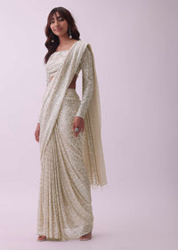 Off-White Sequins Saree And Blouse With Cowl Sleeves And Tassels