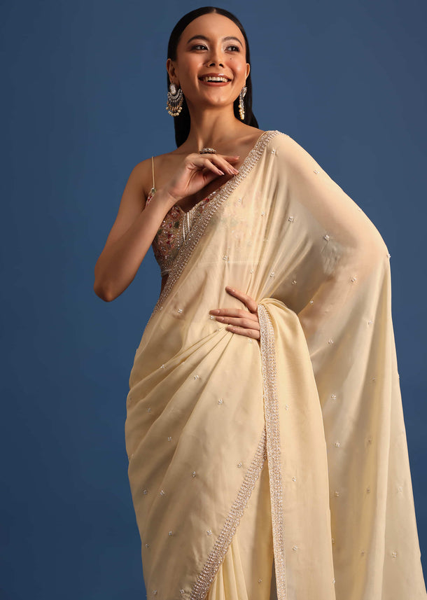 Off White Cutdana Embroidered Crepe Saree With Unstitched Blouse