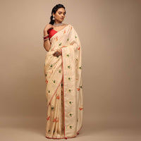 Off White Saree In Dola Silk With Woven Patola Buttis And Red Unstitched Blouse