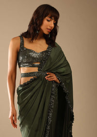 Olive Green Saree In Crepe With Sequins Ruffle On The Border, Sequins Blouse With Front Cut Out And Embellished Belt