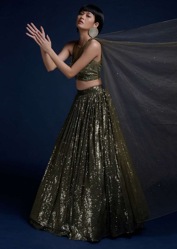 Olive Green Lehenga Embellished In Sequins And Cut Dana Embellished Crop Top With Attached Net Cape