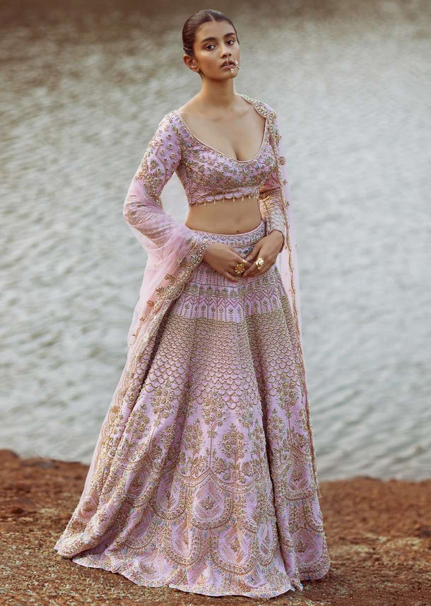 Onion Pink Lehenga Choli In Raw Silk With Embossed Embroidery In Elaborate Scallop Design And Floral Motifs Online - Kalki Fashion