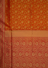 Orange brocade saree in floral motif