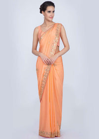 Orange chiffon silk saree with embroidered butti border only on Kalki