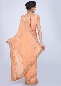 Orange chiffon silk saree with embroidered butti border only on Kalki