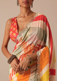 Orange Muslin Saree With Mirror Scallop Border And Unstitched Blouse Fabric