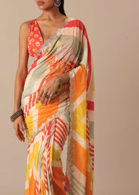 Orange Muslin Saree With Mirror Scallop Border And Unstitched Blouse Fabric