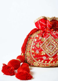 Orange Potli Bag In Silk With Bandhani Print And Gotta Patti Embroidery