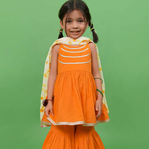 Kalki Girls Orange Sharara Suit In Cotton With Gotta Patti Embroidery And A Tie Dye Dupatta By Tiber Taber
