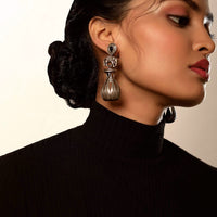 Oxidised Earrings With Carved Elephant Motif And Studded With A Blue Semi Precious Stone