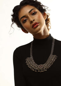 Oxidised Long Necklace With Floral Centre Adorned In Red Stones And Ghungru Tassels