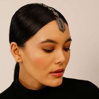 Oxidised Silver Mangtika With Carved Ethnic Motif Studded In Green Stones And Pearls