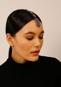 Oxidised Silver Mangtika With Carved Ethnic Motif Studded In Green Stones And Pearls