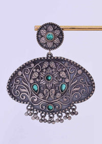 Oxidized self carved dangler in floral moti with green beads only on Kalki