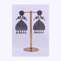 Oxidized self carved metal dangler with emerald green bead only on Kalki