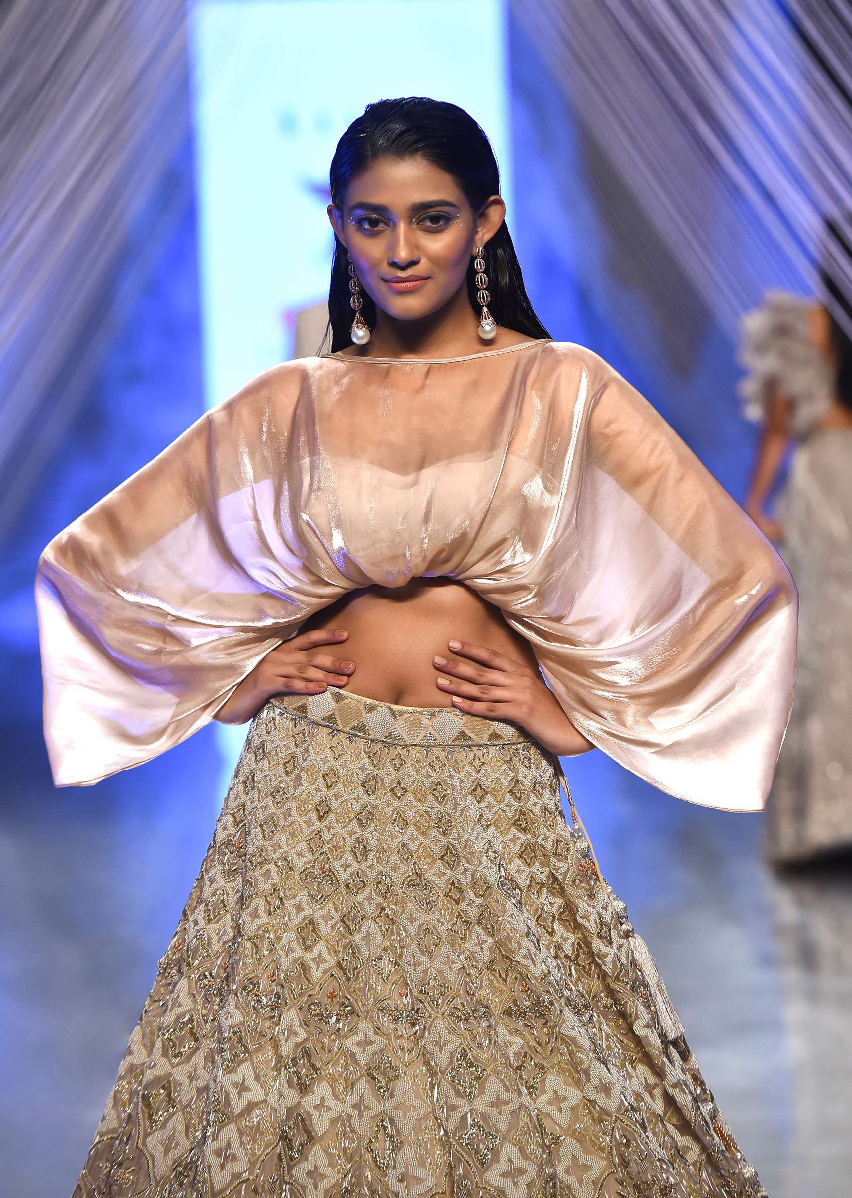 Oyster Lehenga With An Organza Cape Top And Cut Dana Handwork On The Lehenga