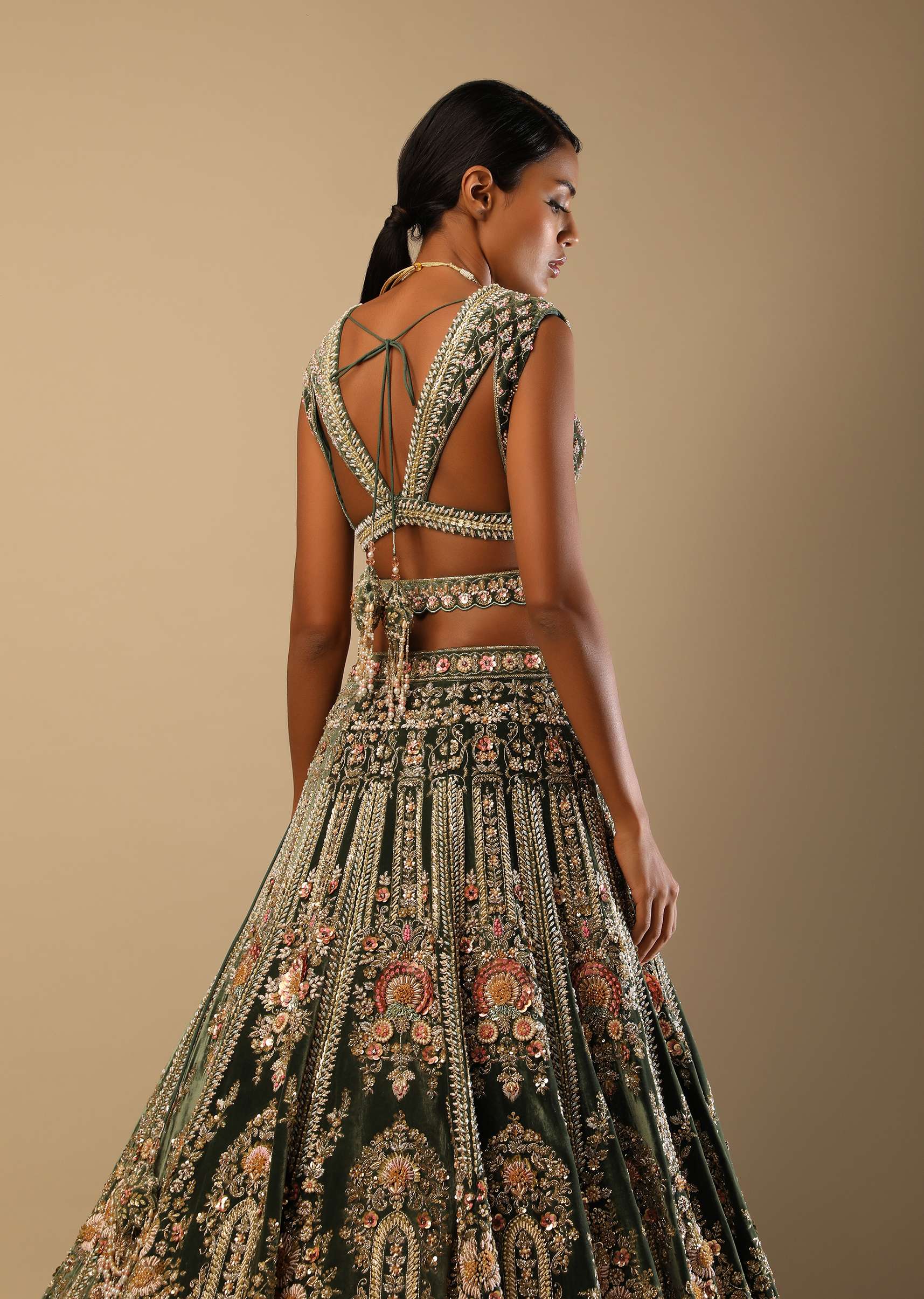 Palace Green Lehenga Choli In Velvet With Multi Colored Hand Embroidered Heritage Kalis With Hints Of Flowers