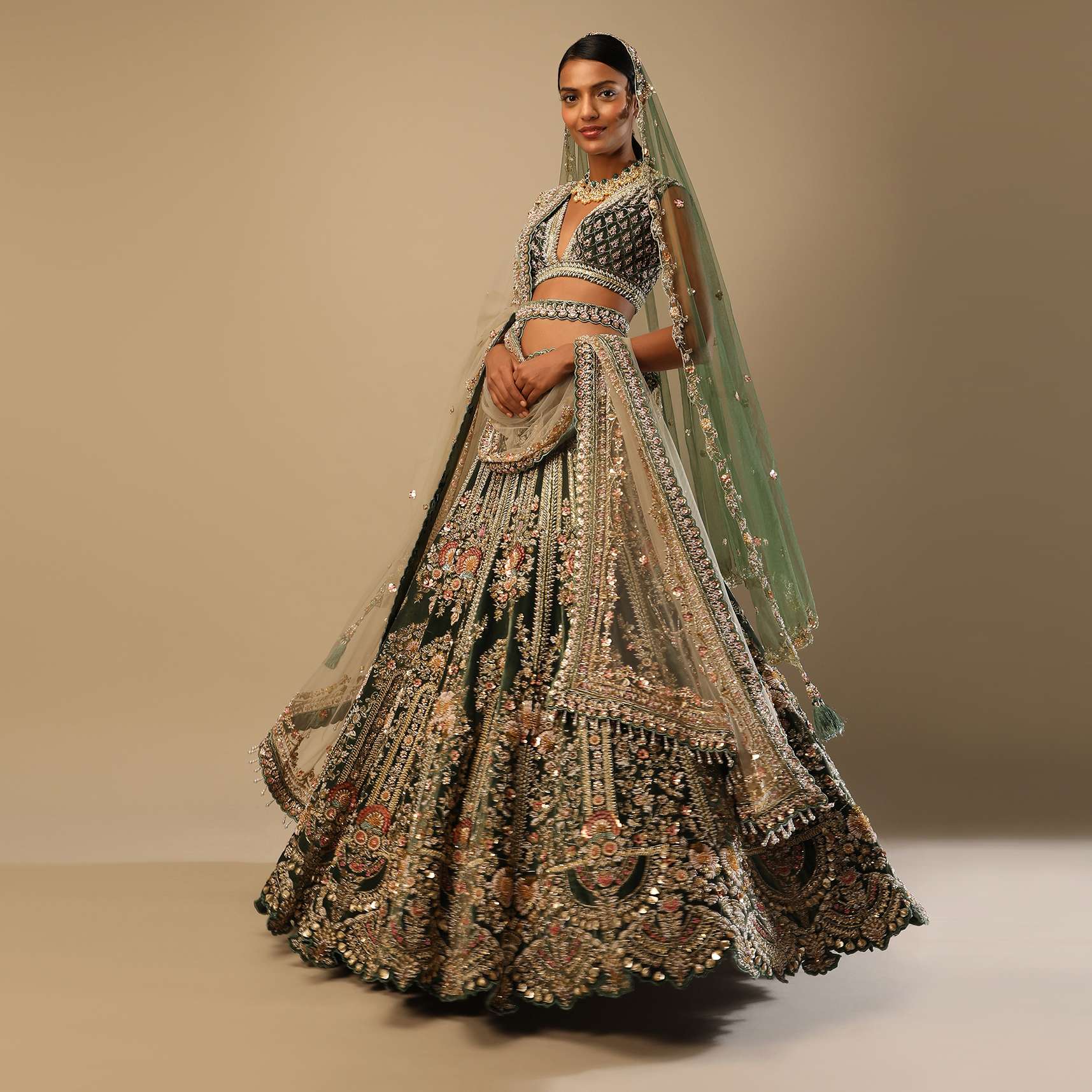 Palace Green Lehenga Choli In Velvet With Multi Colored Hand Embroidered Heritage Kalis With Hints Of Flowers
