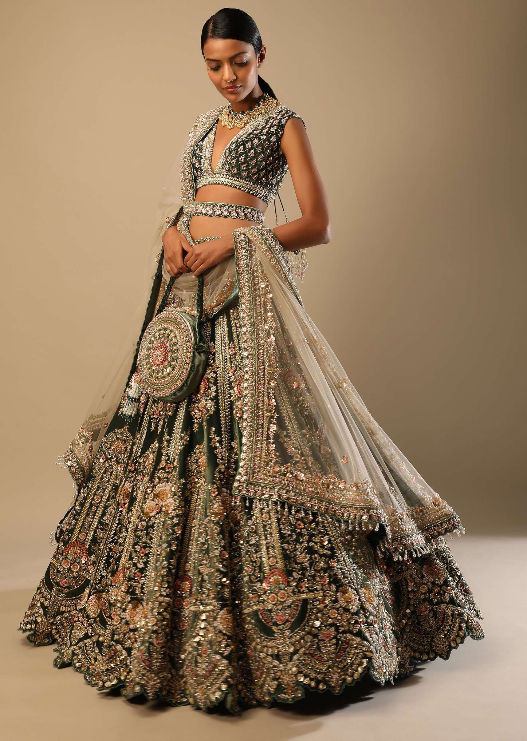 Palace Green Lehenga Choli In Velvet With Multi Colored Hand Embroidered Heritage Kalis With Hints Of Flowers