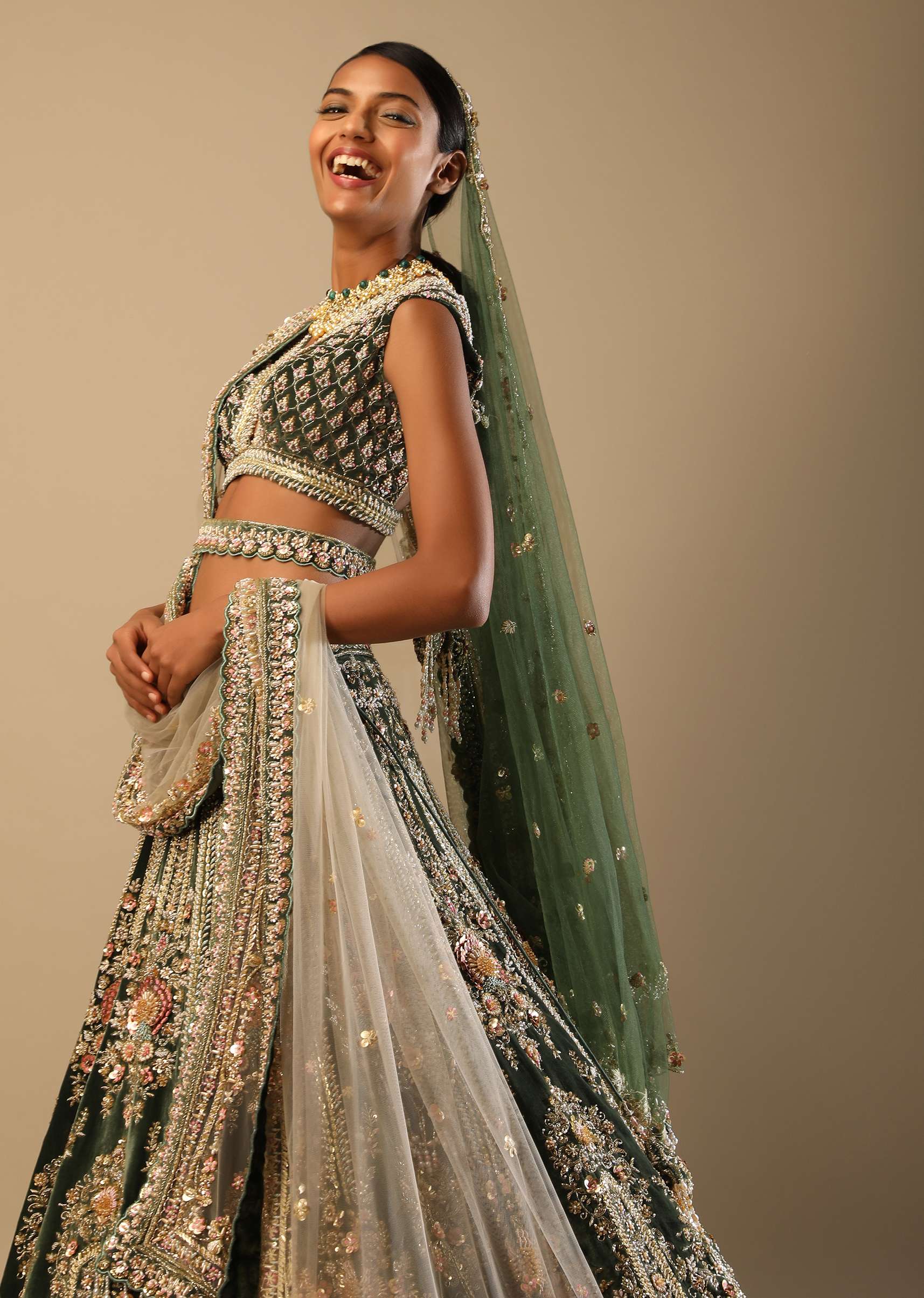 Palace Green Lehenga Choli In Velvet With Multi Colored Hand Embroidered Heritage Kalis With Hints Of Flowers