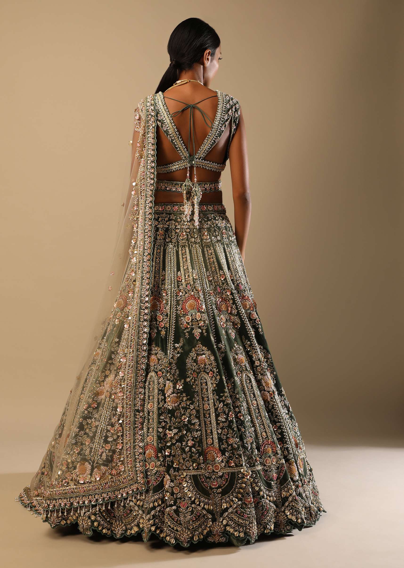 Palace Green Lehenga Choli In Velvet With Multi Colored Hand Embroidered Heritage Kalis With Hints Of Flowers