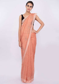 Pale orange linen saree with self moti embroidery and butti only on Kalki