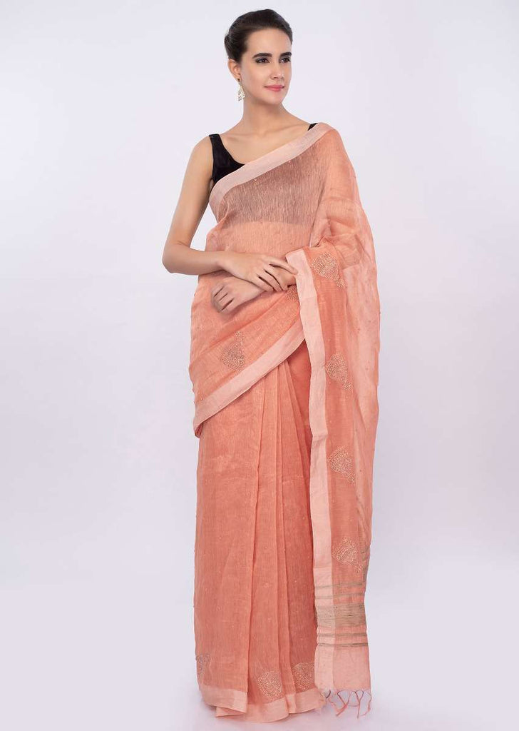 Pale orange linen saree with self moti embroidery and butti only on Kalki