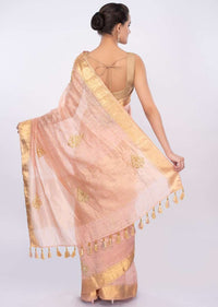 Pale peach linen saree with cut dana and zari butti only on Kalki