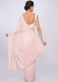 Pale pink georgette saree with self floral embroidery and butti only on kalki