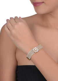 Gold Plated Wave Shaped Bracelet Adorned With Pearls And Stones Online - Kalki Fashion