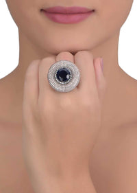 Gunmetal grey stone studded round ring with midnight blue crystal in the center only on Kalki