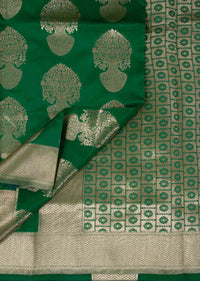 Parakeet green banarasi silk saree in floral pot weaved butti 