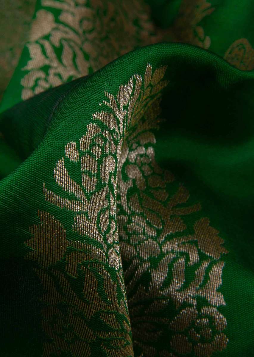 Parakeet green banarasi silk saree in floral pot weaved butti 