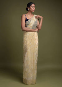 Parchment White Saree In Net With Weaved Golden Floral Motifs And Kundan Work Online - Kalki Fashion