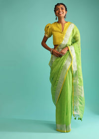 Parrot Green Saree In Linen With Silver Brocade Border And Striped Pallu Along With Yellow Unstitched Blouse