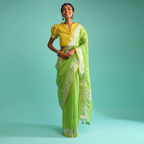 Parrot Green Saree In Linen With Silver Brocade Border And Striped Pallu Along With Yellow Unstitched Blouse