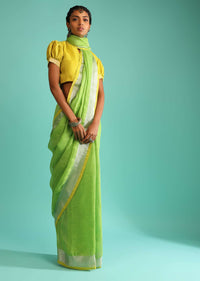 Parrot Green Saree In Linen With Silver Brocade Border And Striped Pallu Along With Yellow Unstitched Blouse