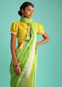 Parrot Green Saree In Linen With Silver Brocade Border And Striped Pallu Along With Yellow Unstitched Blouse