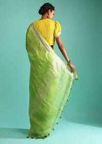 Parrot Green Saree In Linen With Silver Brocade Border And Striped Pallu Along With Yellow Unstitched Blouse