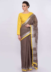 Pastel brown jute cotton saree with yellow border only on Kalki