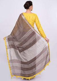 Pastel brown jute cotton saree with yellow border only on Kalki